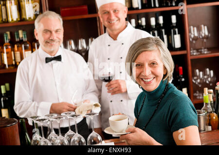 Restaurant smiling manager with staff wine bar Stock Photo