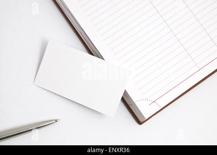 Empty business card with diary and pen isolated on white Stock Photo