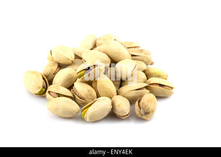 pistachios in a glass plate, isolated on white background Stock Photo