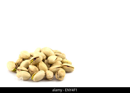 pistachios in a glass plate, isolated on white background Stock Photo