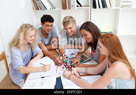 Teenagers studying Science in a library Stock Photo