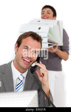 Businesswoman bringing a lot of work to her colleague Stock Photo
