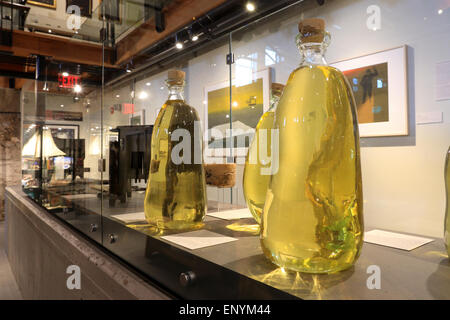 Nantucket Massachusetts Whaling museum. Exhibit displaying sperm whale oil spermaceti oil, stored in glass bottles. Nantucket Island. Stock Photo