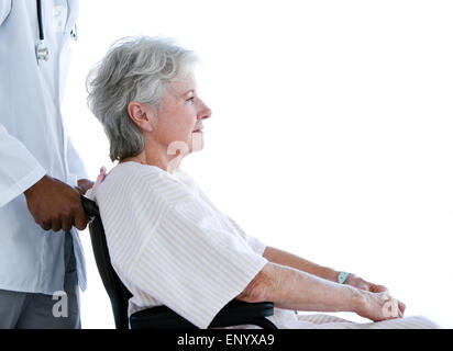 Portrait of a senior woman sitting on a wheelchair in a hospital Stock Photo