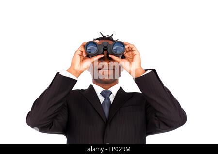 Confident Afro-American businessman with binoculars against a white background Stock Photo