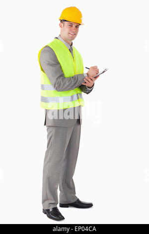 Portrait of a smiling contractor taking notes Stock Photo