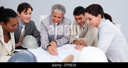 Constructors in a meeting studying plans Stock Photo