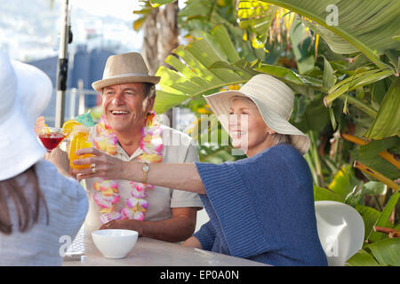 Friends drinking  together under the sun Stock Photo