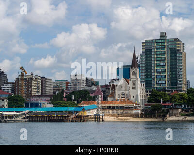 Waterfront in downtown of Dar es Salaam, Tanzania in East Africa, with St. Joseph church and modern architecture. Horizontal. Stock Photo