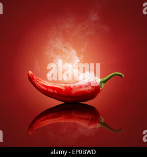 Smoking hot red chilli with reflection Stock Photo