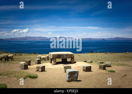 Sheep grazing around the Ceremonial Table on Isla del Sol (Island of the Sun) in Lake Titicaca, Bolivia Stock Photo