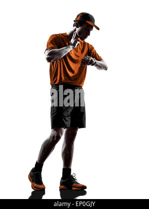one young man runner jogger taking heartbeat pulse in silhouette isolated on white background Stock Photo