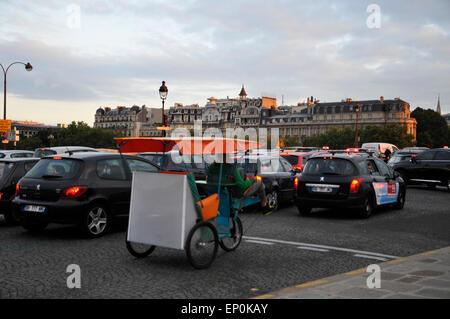 Paris Place de Concorde Traffic congestion Foreground a rickshaw  Ile de Paris France Europe Stock Photo