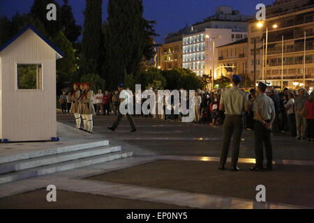 Athens, Greece. 12th May, 2015. The changing of the guards at the Tomb of the Unknown Soldier continues as normal while the protest is hold in the space in front of it. People gathered outside the Greek Parliament, to protest against the Education Bill that was discussed inside the Parliament and called for a rejection of the bill. The protest was attended by parliamentary spokesman of Néa Dimokratía Adonis Georgiadis. © Michael Debets/Pacific Press/Alamy Live News Stock Photo