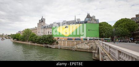 An Apple iPhone billboard and construction screen covering the reconstruction on the Palais de Justice in Paris, France. Stock Photo