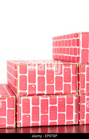 Cardboard brick column graph showing steady growth Stock Photo