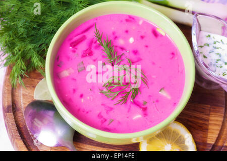 Cold beet soup with herbs on the table Stock Photo