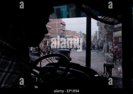 Kathmandu, Nepal. 12th May, 2015. People fled into streets after a magnitude 7.3 earthquake has hit Nepal as the country recovers from last month's devastating earthquake, in Kathmandu, Nepal. A massive earthquake of magnitude 7.4 hit Nepal capital Kathmandu on Tuesday triggering strong tremors which were felt across Delhi and other parts of north India. © Khairil Safwan/Pacific Press/Alamy Live News Stock Photo