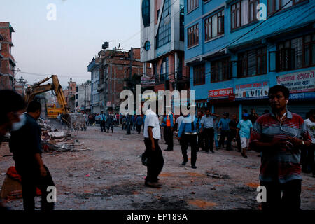 Kathmandu, Nepal. 12th May, 2015. People fled into streets after a magnitude 7.3 earthquake has hit Nepal as the country recovers from last month's devastating earthquake, in Kathmandu, Nepal. A massive earthquake of magnitude 7.4 hit Nepal capital Kathmandu on Tuesday triggering strong tremors which were felt across Delhi and other parts of north India. © Khairil Safwan/Pacific Press/Alamy Live News Stock Photo