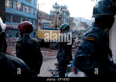 Kathmandu, Nepal. 12th May, 2015. Rescue team officials look on during their search for survivors at a collapsed building in Kathmandu. A massive earthquake of magnitude 7.3 hit Nepal capital Kathmandu on Tuesday triggering strong tremors which were felt across Delhi and other parts of north India. © Khairil Safwan/Pacific Press/Alamy Live News Stock Photo