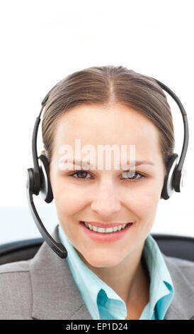 Young businesswoman on the phone with earpiece Stock Photo