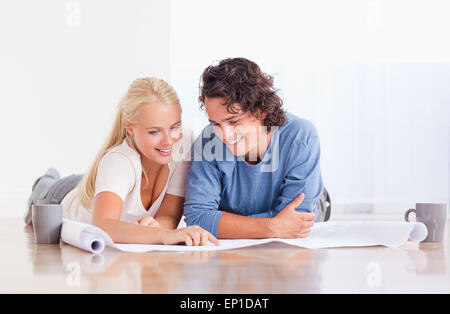 Smiling couple getting ready to move in a new house Stock Photo