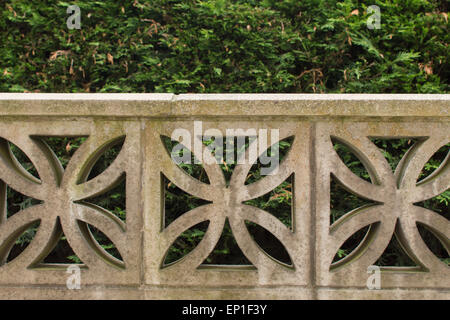 Garden wall built from decorative concrete blocks Stock Photo