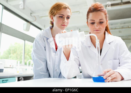 Scientists doing an experiment Stock Photo