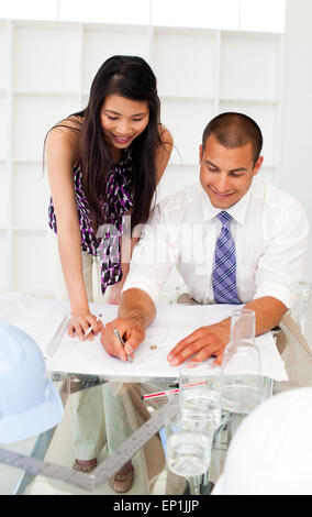 Two engineers studying plans Stock Photo