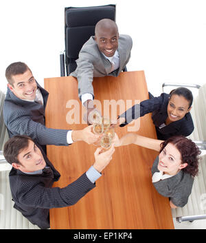 HIgh view of business team toasting with champagne in a meeting Stock Photo