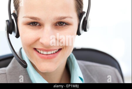Portrait of a pretty operator with earpiece Stock Photo