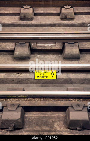 Perigo de Morte Sign on train tracks in Lisbon - Portugal Stock Photo