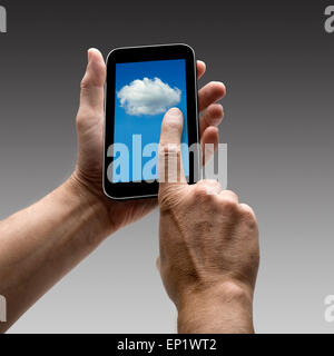 Holding Clouds screen on smart phone. There is a route for hand and finger. Stock Photo
