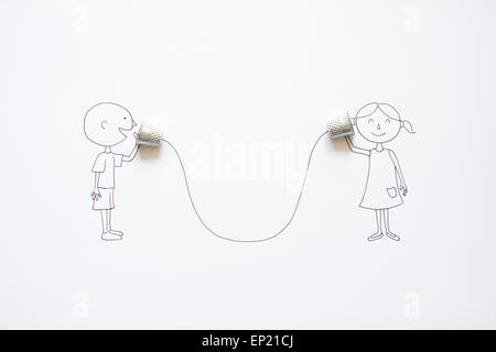 Conceptual boy and girl talking with tin can phones Stock Photo