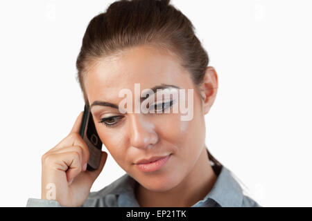 Close up of businesswoman listening closely to caller Stock Photo