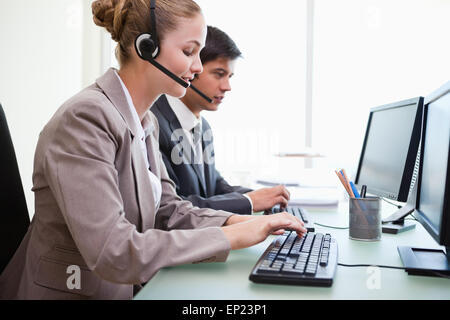 Operators working with computers Stock Photo