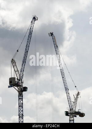 Two tall cranes working on a building site in London, UK. Stock Photo