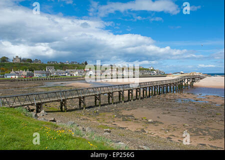The Lossiemouth wooden bridge to the East beach crosses the River Lossie estuary. SCO 9789. Stock Photo