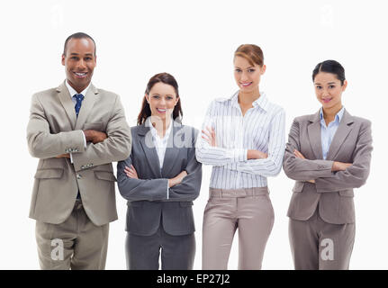 Close-up of a business team smiling side by side and crossing their arms Stock Photo