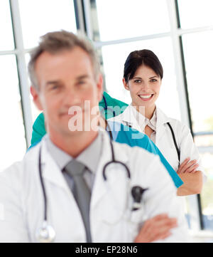 Female doctor in a row smiling at the camera Stock Photo