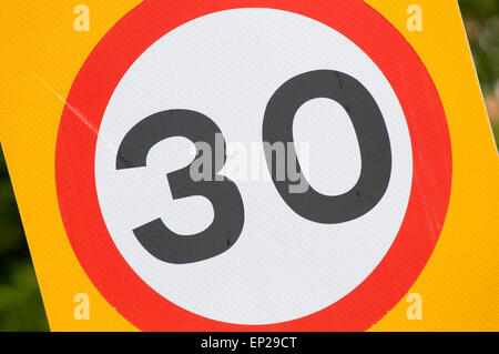 30 mph miles per hour thirty speed limit limits speeding restrictions restricted urban road roads road sign signs Stock Photo