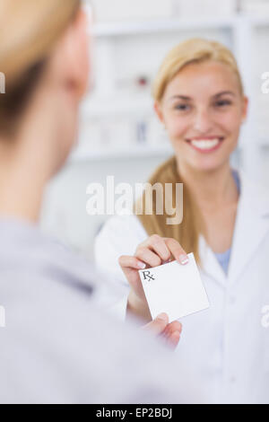 Someone giving a prescription to a pharmacist Stock Photo