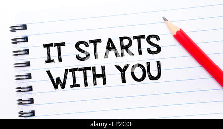 It Starts with You Text written on notebook page, red pencil on the right. Concept image Stock Photo