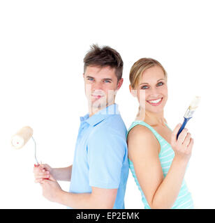 Charming couple smiling at the camera against white background Stock Photo