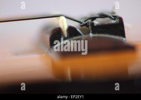 Classical guitar bridge and string close-up Stock Photo
