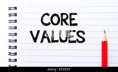 Core Values Text written on notebook page, red pencil on the right. Motivational Concept image Stock Photo