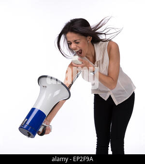 Businesswoman shouting at herself with megaphone isolated on a white background Stock Photo