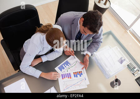 Above view of consultant analyzing data with her client Stock Photo