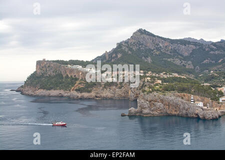 Flock of seagulls crowd around a fishing boat returning with catch on April 22, 2015 in Port de Soller, Mallorca. Stock Photo