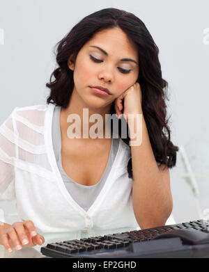 Young businesswoman getting bored Stock Photo